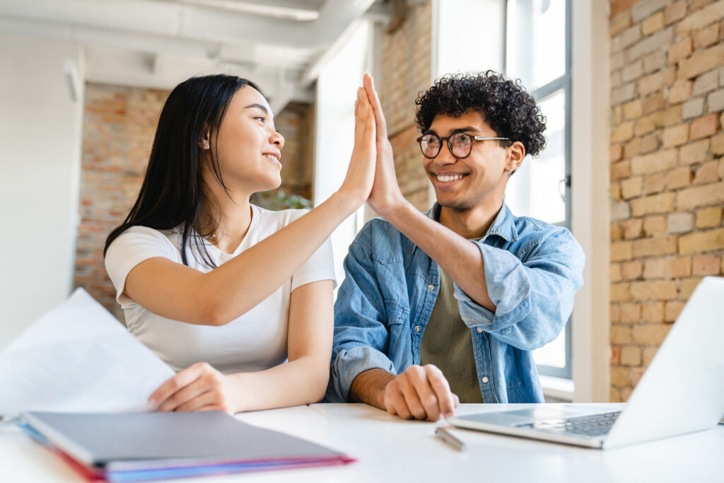 A man and woman high five