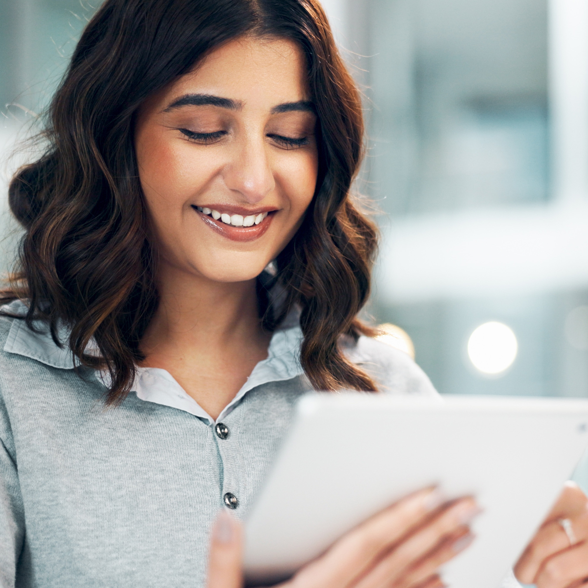 A woman reading a tablet
